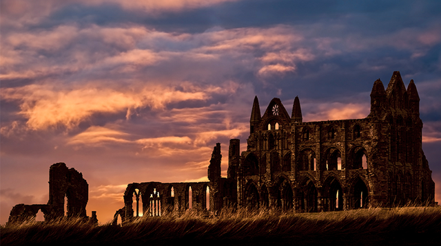 Sun setting over Whitby Abbey